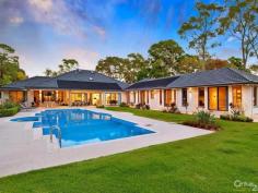 Glenhaven NSWResort Style Living on Acreage A masterpiece of contemporary design is this luxurious property set on 6 acres (approx.) in one of Hills Districts' sought after prime position. The stunning architecture of this home blends beautifully with the natural bushland setting. With approximately 5 arable acres, this home offers the best of both worlds, perfect sanctuary away from the hustle & bustle whilst having the convenience of being within a short drive from Castle Towers Shopping Centre, local schools, medical centres and transport.  Featuring high ceilings throughout and a light filled floor plan you'll enjoy the pool and garden views from every corner of this spectacular home. With everything a family can wish for and more, you will be spoilt for choice!  * Gorgeous driveway with automatic gates leading to the front porch overlooking the koi pond  * Impressive entrance through the double doors leading to the formal and informal areas  * Stunning high quality kitchen with stone bench tops, large walk-in pantry, dishwasher, built-in double oven plus coffee machine, water filter and more  * Casual dining and living areas off kitchen overlooking the pool with bushland view  * Formal dining room opening onto private paved terrace  * Master bedroom suite with walk-in robe, additional cupboards and ensuite with his & hers vanity  * Additional 4 double sized bedrooms each with walk-in wardrobes and ensuite to 3  * Study room/home office fitted with built-in storage and wash closet  * Loft style staircase leading to the separate large attic - ideal for man cave or kids hideout  * Sprawling poolside alfresco and BBQ area with gas outlets  * Wet bar adjoining main entertaining areas  * Lavish sun-drenched 25m inground swimming pool and spa equipped with solar heating  * 2 underground water tanks  * Championship sized tennis court - Hold your own grand slam!  Additional lifestyle features include ducted air conditioning throughout, natural gas outlets, alarm system, video security system, polished hardwood floors, floor heating and four car garage with automatic doors. A rare opportunity to live an enviable lifestyle so close to all amenities yet giving you the space and privacy of acreage property!  The photos and description cannot replace the experience of a walk through inspection.  To arrange for a private viewing call Ruma Mundi on 02 8883 1088 or 0411 030 202. 