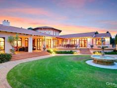 Dural NSWStory Of A Fairy Tale A beautiful blend of timeless charm and modern styling is this magnificent double bricked home set on 1.43 (approx.) desirable landscaped hectares. Every direction you turn there is something amazing to see from water features to amazing gardens to the detail of the architectural design of the home.  Upon entering the driveway through the wrought iron electric gates you will immediately feel as though you have stepped into a fairy tale! You will love the impressive grand entrance with marble floors, huge crystal chandeliers and sublimely crafted centre piece. The style and features of this property cannot be expressed purely in words. However, here is a taste of what this magnificent estate comprises of:  * Elegant formal lounge room with fireplace expanding to the sunken formal dining room  * Gourmet timber kitchen equipped with Miele appliances, granite bench-tops, dishwasher, 3 ovens, microwave and an island bench with a selection of cooking elements  * Huge walk-in pantry leading to the cool room  * Meals area off kitchen  * Family room with fireplace  * Casino dubbed room off family room  * Ballroom with bar, stage, commercial grade kitchen fit for a chef plus a billiard room - Perfect to host your own Great Gatsby party!  * Additional lounge room with pitched wooden panel ceiling, sink and French doors opening to the yard  * Master bedroom with walk-in robe, ensuite and it's own courtyard  * Ensuite to the other 4 bedrooms in the main house  * Resort style bathroom with spa, dual sink, shower and toilet room  * Guest wash closets  * Cancel your gym membership as it includes a gymnasium room and sauna  * Extra living room with laundry tub to the right wing  * The guest house features a lounge & dining room, kitchen with dishwasher, 2 bedrooms and bathroom with separate toilet  * 2 entertainment areas overlooking the pool and BBQ area  * Alluring salt water inground pool with spa, waterfall and it's own island surrounded by palm trees and plants  * Hold your own grand slam with this full size tennis court  * Lots of grass area - perfect for playing croquet or equestrian  * 22x12m shed/mechanic workshop with stable  * 6-car automatic garage  Additional features include: imported Italian wallpaper, ducted air conditioning throughout, alarm system, intercom, security camera system, detailed cornices, high ceilings, feature skylights, French doors & windows, huge laundry, study room, 35,000L underground water tank, septic tank, timers to the external lights and fountains.  Turn your dream into a reality!  For a full list of inclusions and to arrange a private inspection, call Ruma Mundi today on 0411 030 202 or 02 8883 1088. 