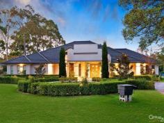 Glenhaven NSWResort Style Living on Acreage A masterpiece of contemporary design is this luxurious property set on 6 acres (approx.) in one of Hills Districts' sought after prime position. The stunning architecture of this home blends beautifully with the natural bushland setting. With approximately 5 arable acres, this home offers the best of both worlds, perfect sanctuary away from the hustle & bustle whilst having the convenience of being within a short drive from Castle Towers Shopping Centre, local schools, medical centres and transport.  Featuring high ceilings throughout and a light filled floor plan you'll enjoy the pool and garden views from every corner of this spectacular home. With everything a family can wish for and more, you will be spoilt for choice!  * Gorgeous driveway with automatic gates leading to the front porch overlooking the koi pond  * Impressive entrance through the double doors leading to the formal and informal areas  * Stunning high quality kitchen with stone bench tops, large walk-in pantry, dishwasher, built-in double oven plus coffee machine, water filter and more  * Casual dining and living areas off kitchen overlooking the pool with bushland view  * Formal dining room opening onto private paved terrace  * Master bedroom suite with walk-in robe, additional cupboards and ensuite with his & hers vanity  * Additional 4 double sized bedrooms each with walk-in wardrobes and ensuite to 3  * Study room/home office fitted with built-in storage and wash closet  * Loft style staircase leading to the separate large attic - ideal for man cave or kids hideout  * Sprawling poolside alfresco and BBQ area with gas outlets  * Wet bar adjoining main entertaining areas  * Lavish sun-drenched 25m inground swimming pool and spa equipped with solar heating  * 2 underground water tanks  * Championship sized tennis court - Hold your own grand slam!  Additional lifestyle features include ducted air conditioning throughout, natural gas outlets, alarm system, video security system, polished hardwood floors, floor heating and four car garage with automatic doors. A rare opportunity to live an enviable lifestyle so close to all amenities yet giving you the space and privacy of acreage property!  The photos and description cannot replace the experience of a walk through inspection.  To arrange for a private viewing call Ruma Mundi on 02 8883 1088 or 0411 030 202. 