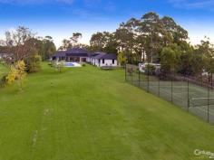 Glenhaven NSWResort Style Living on Acreage A masterpiece of contemporary design is this luxurious property set on 6 acres (approx.) in one of Hills Districts' sought after prime position. The stunning architecture of this home blends beautifully with the natural bushland setting. With approximately 5 arable acres, this home offers the best of both worlds, perfect sanctuary away from the hustle & bustle whilst having the convenience of being within a short drive from Castle Towers Shopping Centre, local schools, medical centres and transport.  Featuring high ceilings throughout and a light filled floor plan you'll enjoy the pool and garden views from every corner of this spectacular home. With everything a family can wish for and more, you will be spoilt for choice!  * Gorgeous driveway with automatic gates leading to the front porch overlooking the koi pond  * Impressive entrance through the double doors leading to the formal and informal areas  * Stunning high quality kitchen with stone bench tops, large walk-in pantry, dishwasher, built-in double oven plus coffee machine, water filter and more  * Casual dining and living areas off kitchen overlooking the pool with bushland view  * Formal dining room opening onto private paved terrace  * Master bedroom suite with walk-in robe, additional cupboards and ensuite with his & hers vanity  * Additional 4 double sized bedrooms each with walk-in wardrobes and ensuite to 3  * Study room/home office fitted with built-in storage and wash closet  * Loft style staircase leading to the separate large attic - ideal for man cave or kids hideout  * Sprawling poolside alfresco and BBQ area with gas outlets  * Wet bar adjoining main entertaining areas  * Lavish sun-drenched 25m inground swimming pool and spa equipped with solar heating  * 2 underground water tanks  * Championship sized tennis court - Hold your own grand slam!  Additional lifestyle features include ducted air conditioning throughout, natural gas outlets, alarm system, video security system, polished hardwood floors, floor heating and four car garage with automatic doors. A rare opportunity to live an enviable lifestyle so close to all amenities yet giving you the space and privacy of acreage property!  The photos and description cannot replace the experience of a walk through inspection.  To arrange for a private viewing call Ruma Mundi on 02 8883 1088 or 0411 030 202. 
