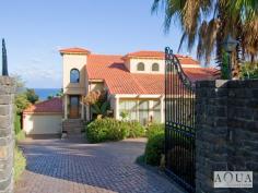 5 Bay Avenue Mount Eliza VIC 3930 Golden Mile Mediterranean The home includes a variety of living spaces including an entertaining lounge with stone fireplace and a formal dining room with glass doors to a covered entertaining balcony. The lower level offers a vast rumpus room with an open fireplace, a full wet bar and glass doors for direct access to the pool area.   The commanding and expansive master suite opens out to the pool terrace and features a fitted dressing room and a marble, twin vanity, spa en-suite.  The mid level comprises a study, 3 spacious bedrooms served by an expansive family bathroom and a guest bedroom with built in robes and a spa en-suite.   