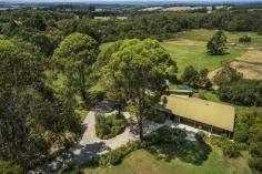 155-159 Bittern-Dromana Road Merricks North VIC 3926 Bombora Vista Perched high upon the rolling fields of the exclusive enclave of Merricks North, this delightful and expansive family home is the perfect Mornington Peninsula retreat.    Less than one hour from the city and comprising two titles, this magnificent property enjoys approx 2.6 acres of manicured lawns and gardens and looks across farmland to a captivating view of Westernport Bay and Phillip Island.   The three level brick and timber house has featured in style and design magazine, Inside Out, and boasts an upstairs master bedroom complete with walk through robes, an ensuite with claw foot bath that looks out across the garden, and a private deck enjoying the view through the trees.    There’s a further three, vast children’s bedrooms, one with ensuite, a family bathroom, large living room with fireplace, and dining area. A bright and sunny kitchen and adjacent breakfast alcove also bask in the extensive views. On the lower level is a big and cosy lounge room, while upstairs, an office/study also has the benefit of the glorious garden outlook and a deck complete with flagpole and weather vane.   A paved courtyard at the front enjoys the Mornington Peninsula tranquility while the back of the house is wrapped in a huge deck, maximising the incredible vista.   Just minutes from both Balnarring and Red Hill shopping centres, cafes and restaurants, and smack bang in the heart of wine country, this truly glorious property offers a most desirable slice of Mornington Peninsula living. 