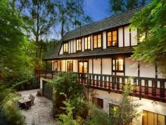 ONE-OF-A-KIND DREAM HOME, EXCLUSIVE SETTING 7 PERRINS CREEK ROAD, OLINDA, VIC 3788 4 2 6 Entertainers paradise  Exclusive privacy and tranquillity  Lush low-maintenance forest setting Set on approximately 1 acre of low-maintenance garden surrounds with another 9 acres of lush private forest offering pure peace and serenity, this much-loved property with widespread parquetry flooring and cable internet offers flexible living over 3 distinct levels. With its gorgeous Tudor architectural style modelled on the best of Western Europe; Feathertop, a hidden gem of a property nestled amongst giant poplars and lush ferns is the ultimate seclusion weekender, fairytale family home or even possible one-of-a-kind B&B while being only 15 minutes away from the Monash Freeway. On the entry level find an expansive living room (with bay window), separate dining and extensive kitchen (boasting Blanco appliances); powder room and private study with built-in mahogany wall units. Decorative Oregon ceiling beams extend throughout. An amazing spiral wooden staircase ascends to a vast master bedroom with ensuite (double shower). 2 further bedrooms and a huge main bathroom with spa bath and double basins can be found under the characteristically steeply pitched roof. All bedrooms include high quality crafted built-in robes and chests of draws and their own private balconies. Additional storage area in the attic completes the 1st floor. The open plan basement provides the perfect opportunity to escape the summer holiday heat. Set up your own theatre or games room, gym and wine cellar. Also discover on this floor a separate laundry, additional powder room and internal access to a 6 car concrete built garage. Perfect for entertaining, your guests who will love to visit this picturesque setting - entertain amongst the treetops in the paved outdoor areas or on the extensive balcony surrounding the first level. If you have ever wanted a fairy tale life or home to be captivated by, Feathertop will make your dreams come true! FOR SALEExpressions Of Interest FEATURES GENERAL FEATURES Property Type:   House Bedrooms:   4 Bathrooms:   2 INDOOR Indoor Spa Built in Wardrobes Dishwasher Air Conditioning OUTDOOR Garage Spaces:   6 OTHER FEATURES Privacy and Tranquillity, Entertaining terraces, Tudor architecture , Parquetry flooring CONTACTS SCOTT BANKS Mobile: 0411 700 099 Email this agent 