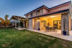  26 Chivalry Way, Atwell WA This home has the "WOW" factor! From the moment you walk in you will be pleasantly surprised by this executive double storey home located in the exclusive Harvest Lakes Estate and offering 305sqm of stylish living space on a 640sqm block. Through the lead light double entry doors you are greeted with the warmth of the magnificent polished solid timber Karri flooring. Space, style and fantastic features combine to create a dream come true.... at a price you can afford. A real 'DESIGNER' experience awaits with a combination of a modern colour scheme and bulk head ceilings that are higher and normal. This adds to the feeling of space and comfort. A shoppers entry leads into the kitchen making life that much easier. The open plan kitchen has plenty of storage, Bosch dishwasher, a useful appliance cupboard and double fridge recess. The walk in pantry will cater for all your storage needs. This home will impress every member of the family. Porcelain tiled and balustrade staircase leads you to the 2nd level which offers a massive master bedroom and ensuite with double vanity, double shower, and oval spa and separate wc. Also located upstairs is 5 queen size bedrooms all with built in robes and main bathroom with separate wc. The casual living sun room is 2 storey's high with floor to ceiling windows which passively heats the home in winter. An added bonus, is the fitted roller shutters for protection during the summer months. French doors lead to the tiled alfresco area. perfect for entertaining. The easy care lush lawns and gardens are reticulated from a private bore. Remember these are the features of your new dream home: - Home office with store room - Formal lounge - Massive kitchen, meals, family room - Solar passive sun room - Alfresco dining with tiled floor - Master bedroom suite with balcony and hotel style spa ensuite - 5 Queen sized bedrooms - Main bathroom with spa - Reverse cycle ducted air conditioning throughout - 32 Course high ceilings - Solid Karri polished timber floors - Room for boat, trailer or caravan - Temperature controlled gas HWS & Gas bayonet in family room Close by: Harmony Primary School, Atwell College, Buggles Childcare Centre and the soon to be opened Woolworths Shopping complex.   