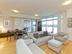  20/880 Canning Highway, APPLECROSS WA  FIRST HOME OPEN SAT 2:00 - 2:40pm. What is your life priority? Security? Lock n Leave? Peace? Your own space? From the wide and elegant entry foyer, all the way up to the expansive balcony views and impressive interior finishes, there is a lot to love with this Applecross apartment.  The security tab activated lift heads up to the front door - and with only two apartments on the level, privacy is guaranteed. Walk into the entry hallway - lined with stylish bamboo flooring (cushioned for sound proofing) and take in the views and the sunshine all in one go, thanks to large floor-to-ceiling window. The custom-made patterned vertical blinds complete the look. The kitchen cleverly incorporates plenty of handy and concealed storage options - including a series of cupboards neatly tucked away as part of the breakfast bar. Stone benchtops with a waterfall edge offer a sophisticated look while the combination of Miele and Smeg appliances, room for a double fridge and an extra-wide oven is sure to please casual cooks as well as serious entertainers. Sliding doors lead out to the partially enclosed balcony, offering views of leafy Applecross and river glimpses and uninterrupted city views. Automated blinds are a clever inclusion and are controlled by the sun, so while you are at work or play, your environment is protected. Inside, zoned Fujitsu reverse-cycle air-conditioning is also on offer.  The master suite includes two mirrored, sliding robes - both of which have fitted out beautifully with plenty of hanging and storage space, as well as access to the luxury ensuite, featuring a large shower, spa bath and full height tiling. Two additional bedrooms offer stunning river views and balcony access. With resort style facilities available on the ground level - including a pool, spa and gym, as well as undercover parking for two cars and a private storage area, everything is at your fingertips.   