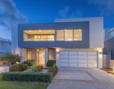 86 Shipmaster Avenue, Alkimos WA CONTEMPORARY CLASS! ALKIMOS   Date Available:  NOW For Sale:  From $769,000 Stunning crisp clean lines pervade this ex-display family home that is packed full of design features for everyone to enjoy. Enviably situated in the magnificent Shorehaven Estate just 20 minutes north of Joondalup, you will be immersed by other quality residences that share the complete Alkimos experience. Features include, but are not limited to: -	4 bedrooms, 2 bathrooms -	A light-filled open lounge and dining area is overlooked by a galley kitchen with only the finest in quality integrated appliances, glass splashbacks, a walk-in pantry and sleek cabinetry -	The kitchen itself is highlighted by sparkling stone bench tops, a double sink, a breakfast bar for meals and stunning Bosch appliances (including a gas cook top, two separate ovens, a coffee machine, microwave and dishwasher) -	The main living area leads into an alfresco (with power) for easy-care entertaining and a real indoor-outdoor integration -	A separate gazebo deck doubles outdoor entertaining options with room for a future external kitchen overlooking a tranquil courtyard area with seating -	There is a home theatre room with double doors on the ground floor as well as a separate study or activity area to appease for everybody’s personal needs -	A downstairs sleeping wing includes three carpeted bedrooms with built-in wardrobes, a bathroom with a separate bath and shower, a separate powder area, WC and a quality laundry with tiled splashbacks, built-in storage and outdoor access -	The entire upper level doubles as a parent’s retreat with a sitting room, ocean views from the balcony and a delightful master bedroom suite with a fitted walk-in robe and a fully-tiled stylish ensuite with a huge rain shower, twin vanities and a toilet -	A slice of the sea views from within the master ensemble -	Double remote lock-up garage with internal shopper’s entry -	Recessed ceilings and a gas bayonet to main living zone -	Under-stair storage -	Stunning facade with a decked entrance -	Beautifully manicured gardens and artificial rear lawns – very low-maintenance -	Ducted and zoned reverse-cycle air-conditioning -	Feature down lighting -	Security alarm system (plus CCTV) -	Venetian blinds throughout -	Energy-efficient gas hot water system with heat pump -	A boutique modern design with an endless list of top-class features -	Built by Lorimer Homes/Home Group WA, “The Haven” has a total living area of 343sqm -	528sqm block (approx.) -	Very close to the beach -	Easily accessible to amenities -	Move straight in! General Features Property Type: House Bedrooms: 4 Bathrooms: 2 Garage Spaces: 2 