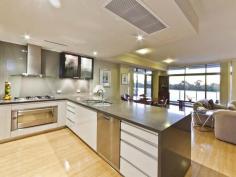 20/880 Canning Highway, APPLECROSS WA  FIRST HOME OPEN SAT 2:00 - 2:40pm. What is your life priority? Security? Lock n Leave? Peace? Your own space? From the wide and elegant entry foyer, all the way up to the expansive balcony views and impressive interior finishes, there is a lot to love with this Applecross apartment.  The security tab activated lift heads up to the front door - and with only two apartments on the level, privacy is guaranteed. Walk into the entry hallway - lined with stylish bamboo flooring (cushioned for sound proofing) and take in the views and the sunshine all in one go, thanks to large floor-to-ceiling window. The custom-made patterned vertical blinds complete the look. The kitchen cleverly incorporates plenty of handy and concealed storage options - including a series of cupboards neatly tucked away as part of the breakfast bar. Stone benchtops with a waterfall edge offer a sophisticated look while the combination of Miele and Smeg appliances, room for a double fridge and an extra-wide oven is sure to please casual cooks as well as serious entertainers. Sliding doors lead out to the partially enclosed balcony, offering views of leafy Applecross and river glimpses and uninterrupted city views. Automated blinds are a clever inclusion and are controlled by the sun, so while you are at work or play, your environment is protected. Inside, zoned Fujitsu reverse-cycle air-conditioning is also on offer.  The master suite includes two mirrored, sliding robes - both of which have fitted out beautifully with plenty of hanging and storage space, as well as access to the luxury ensuite, featuring a large shower, spa bath and full height tiling. Two additional bedrooms offer stunning river views and balcony access. With resort style facilities available on the ground level - including a pool, spa and gym, as well as undercover parking for two cars and a private storage area, everything is at your fingertips.   