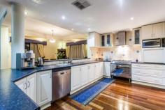  26 Chivalry Way, Atwell WA This home has the "WOW" factor! From the moment you walk in you will be pleasantly surprised by this executive double storey home located in the exclusive Harvest Lakes Estate and offering 305sqm of stylish living space on a 640sqm block. Through the lead light double entry doors you are greeted with the warmth of the magnificent polished solid timber Karri flooring. Space, style and fantastic features combine to create a dream come true.... at a price you can afford. A real 'DESIGNER' experience awaits with a combination of a modern colour scheme and bulk head ceilings that are higher and normal. This adds to the feeling of space and comfort. A shoppers entry leads into the kitchen making life that much easier. The open plan kitchen has plenty of storage, Bosch dishwasher, a useful appliance cupboard and double fridge recess. The walk in pantry will cater for all your storage needs. This home will impress every member of the family. Porcelain tiled and balustrade staircase leads you to the 2nd level which offers a massive master bedroom and ensuite with double vanity, double shower, and oval spa and separate wc. Also located upstairs is 5 queen size bedrooms all with built in robes and main bathroom with separate wc. The casual living sun room is 2 storey's high with floor to ceiling windows which passively heats the home in winter. An added bonus, is the fitted roller shutters for protection during the summer months. French doors lead to the tiled alfresco area. perfect for entertaining. The easy care lush lawns and gardens are reticulated from a private bore. Remember these are the features of your new dream home: - Home office with store room - Formal lounge - Massive kitchen, meals, family room - Solar passive sun room - Alfresco dining with tiled floor - Master bedroom suite with balcony and hotel style spa ensuite - 5 Queen sized bedrooms - Main bathroom with spa - Reverse cycle ducted air conditioning throughout - 32 Course high ceilings - Solid Karri polished timber floors - Room for boat, trailer or caravan - Temperature controlled gas HWS & Gas bayonet in family room Close by: Harmony Primary School, Atwell College, Buggles Childcare Centre and the soon to be opened Woolworths Shopping complex.   