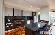  95 Truman Street, South Kingsville VIC Luxuriously large, impressively appointed spaces and an exceptional allotment measuring some 334m2 define the desirability of this designer residence close to Vernon Street village and Newport Lakes Park. Polished parquetry and a gleaming contemporary kitchen with walk-in pantry accompany superb living/dining areas opening to a landscaped courtyard while three bedrooms and three bathrooms, one of each downstairs, are complemented by a TV retreat and inviting terrace. Ample storage, study zone, ducted heating, alarm & secure garage. Superb! 