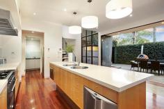 86 Wells Road, Beaumaris VIC Auction 10:30am, Saturday August 9, 2014   $1,295,000 - $1,395,000 3  B  2  b  2  C Watch property video A Statement of Style, Space & Design Get ready to impress with this up to 4 bedroom, 2.5 bathroom spectacular statement of architectural style boasting an exceptional sense of space & an innovative central entertainment zone designed to bring the outdoors in. Superbly positioned only two doors to Illaroo Reserve & pre-school, and a short stroll to the beach, Seaview shops & cafes, schools and the bus.  Beyond a striking copper façade & oversized pivoting door, warm Jarrah & polished concrete floors, expanses of glass & soaring voids define a beautifully balanced layout flooded in northerly light.  Vast living zones are connected to multiple outdoor entertaining areas including a sun drenched central courtyard with glass cafe-style sliders (pizza oven & pond), a private front courtyard with boxed Merbau seating & a shimmering black tiled pool set in rear landscaped gardens. A luxurious Caesarstone & stainless steel appliance kitchen with island bench, butlers' pantry, dual dishwashers & a built in Miele coffee machine is at the heart of inviting family (gas OFP), living & dining areas.  A ground floor study & powder room could double as guest quarters; and complements spacious upstairs bedrooms, 2 with a dual access bathroom & built in robes, and master with his & hers walk in robes and dual vanity, double shower en suite.  Impeccably appointed with all the extras including 3 metre ceilings upstairs & down, extensive storage, ducted heating, evaporative air conditioning, indoor/outdoor surround sound, intercom, security alarm, plantation shutters, Shugg windows, automatic blinds (for void), laundry chute, garden lighting, irrigation, gas pool heating and a direct home access auto double garage. For more information about this statement entertainer please contact Andrew Campbell at Buxton Brighton on 0419 366 545 http://www.86.wellsroadbeaumaris.com/ 
