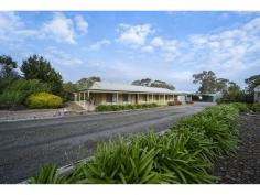 Shop 1 Birdwood Plaza, Shannon St Birdwood SA 5234 2,029m2. Immaculate property comprising large, easily maintained gardens with room to enjoy plus appealing family home with a great outdoor entertaining area, generous amount of shedding. This property has much to offer. LAND 2,029m2. What a great location, situated in one of Birdwood’s most desired streets is this generously sized allotment which is nestled behind a hedge creating a sense of privacy and providing space to utilise and enjoy. The low maintenance gardens bordering the driveway include agapanthus and diosmas. The lemon tree is productive with room in this area of the garden for more fruit trees. The manicured couch front lawn is the perfect contrast to the colourful shrubs and neutral tones of the exterior of the home. The driveway leads to a large parking area and in turn the very good shedding. Paving around the home extends to walkways which is in keeping with the neatness of the whole property. Out the back is a great play area for children and pets with a large undercover entertaining area and lawn all of which has secure fencing. Views can be seen of neighbouring gum studded land from the property which is an ideal setup for those who would like plenty of room around them or to simply enjoy the established grounds as they are. RESIDENCE Beautifully presented inside and out providing inviting and attractive family living. The impressive look of the home is highlighted by the wide verandahs which has paving under foot. The entrance foyer opens to a very spacious yet warm living area which is fitted with a split system air conditioning unit. The floating floors continue into the dining section, through the kitchen and beyond. The kitchen is delightful with modern appliances including gas stainless steel stove, matching range hood, built-in electric oven and ample bench space. The cupboards which are numerous have a stylish country façade yet keep the modern tones of the home. A servery to a casual meals area is a clever idea which also has a sliding door to the undercover outdoor area. The home has a versatile layout easily accommodating four bedrooms or use one of these rooms as a home theatre/additional living area. With built-in robes and cupboards plus a small room suitable for den, dressing room, walk-in robe, there is plenty of storage. There are two bathrooms with the ensuite having recently been updated. Ever walked into a home and felt that warm welcoming feeling? This home certainly gives you that feel. Enjoy outside as much as inside by entertaining friends and family under the gabled roof verandah, or simply relax in this lovely location. IMPROVEMENTS Every good sized allotment needs good shedding. It begins here with a freestanding double carport. Alongside is 22ft x 20ft shed that has a concrete floor, double doors and power. Included is a designated workshop. Next is an open ended garage that has a concrete floor and measures 20ft x 15ft. Other shedding includes a small tool shed and garden shed. Assisting the S.A. water supply are a pair of 3,000 gallon rainwater tanks which are plumbed to the home. SUMMARY A most appealing well presented home and property in a very nice location with plenty to enjoy without a cent to spend. 