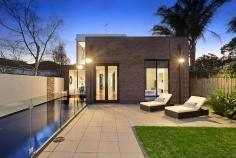 86 Wells Road, Beaumaris VIC Auction 10:30am, Saturday August 9, 2014   $1,295,000 - $1,395,000 3  B  2  b  2  C Watch property video A Statement of Style, Space & Design Get ready to impress with this up to 4 bedroom, 2.5 bathroom spectacular statement of architectural style boasting an exceptional sense of space & an innovative central entertainment zone designed to bring the outdoors in. Superbly positioned only two doors to Illaroo Reserve & pre-school, and a short stroll to the beach, Seaview shops & cafes, schools and the bus.  Beyond a striking copper façade & oversized pivoting door, warm Jarrah & polished concrete floors, expanses of glass & soaring voids define a beautifully balanced layout flooded in northerly light.  Vast living zones are connected to multiple outdoor entertaining areas including a sun drenched central courtyard with glass cafe-style sliders (pizza oven & pond), a private front courtyard with boxed Merbau seating & a shimmering black tiled pool set in rear landscaped gardens. A luxurious Caesarstone & stainless steel appliance kitchen with island bench, butlers' pantry, dual dishwashers & a built in Miele coffee machine is at the heart of inviting family (gas OFP), living & dining areas.  A ground floor study & powder room could double as guest quarters; and complements spacious upstairs bedrooms, 2 with a dual access bathroom & built in robes, and master with his & hers walk in robes and dual vanity, double shower en suite.  Impeccably appointed with all the extras including 3 metre ceilings upstairs & down, extensive storage, ducted heating, evaporative air conditioning, indoor/outdoor surround sound, intercom, security alarm, plantation shutters, Shugg windows, automatic blinds (for void), laundry chute, garden lighting, irrigation, gas pool heating and a direct home access auto double garage. For more information about this statement entertainer please contact Andrew Campbell at Buxton Brighton on 0419 366 545 http://www.86.wellsroadbeaumaris.com/ 