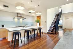 86 Wells Road, Beaumaris VIC Auction 10:30am, Saturday August 9, 2014   $1,295,000 - $1,395,000 3  B  2  b  2  C Watch property video A Statement of Style, Space & Design Get ready to impress with this up to 4 bedroom, 2.5 bathroom spectacular statement of architectural style boasting an exceptional sense of space & an innovative central entertainment zone designed to bring the outdoors in. Superbly positioned only two doors to Illaroo Reserve & pre-school, and a short stroll to the beach, Seaview shops & cafes, schools and the bus.  Beyond a striking copper façade & oversized pivoting door, warm Jarrah & polished concrete floors, expanses of glass & soaring voids define a beautifully balanced layout flooded in northerly light.  Vast living zones are connected to multiple outdoor entertaining areas including a sun drenched central courtyard with glass cafe-style sliders (pizza oven & pond), a private front courtyard with boxed Merbau seating & a shimmering black tiled pool set in rear landscaped gardens. A luxurious Caesarstone & stainless steel appliance kitchen with island bench, butlers' pantry, dual dishwashers & a built in Miele coffee machine is at the heart of inviting family (gas OFP), living & dining areas.  A ground floor study & powder room could double as guest quarters; and complements spacious upstairs bedrooms, 2 with a dual access bathroom & built in robes, and master with his & hers walk in robes and dual vanity, double shower en suite.  Impeccably appointed with all the extras including 3 metre ceilings upstairs & down, extensive storage, ducted heating, evaporative air conditioning, indoor/outdoor surround sound, intercom, security alarm, plantation shutters, Shugg windows, automatic blinds (for void), laundry chute, garden lighting, irrigation, gas pool heating and a direct home access auto double garage. For more information about this statement entertainer please contact Andrew Campbell at Buxton Brighton on 0419 366 545 http://www.86.wellsroadbeaumaris.com/ 