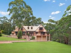  478 Empire Bay Drive Empire Bay NSW 2257 SUPERB ACREAGE - JUST MINUTES FROM KILLCARE, MACMASTERS, AVOCA & TERRIGAL BEACHES. This superb, Master Built home, boasts plenty of space for a large family. There are 6 bedrooms, built-in robes, two with en-suites, opening onto balconies or verandas. A separate lounge, with cosy fire, separate dining, family and rumpus rooms and there is even a library, store rooms and an office. A separate teenage or guest wing opens onto vast deck areas that surround the pool. 3 metre and vaulted ceilings throughout add to the feeling of space. Double hung cedar windows and cedar doors are a feature with wide wraparound verandas that capture the winter sun and summer breezes. A permanent dam with watering system. All set on nearly 4 acres with many other improvements. Minutes to schools and major centres. 