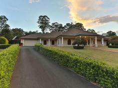 7 Tara Court, Highfields QLD This 720m2 provincial mansion privately nestled amid a beautifully gated 2,882m² landscaped allotment is the ultimate in lifestyle living. Upon entry, a magnificent foyer, the scene is set for the seemingly endless list of unique attributes that are to come. Fine finishes with some local history such as the entrance door from the original St Saviours nunnery. Living spaces offer the flexibility of discreet separation or open plan relaxation, whilst the meals/dining areas flow seamlessly into the open & beautifully equipped chefs kitchen is an inviting area for family & friends to mingle casually.  The main bedroom, boasts a walk in his/hers dressing room/wardrobe through to ensuite with shower & separate toilet. A huge office on the right with a separate wing leading to 3 large queen size rooms, two with walk-in robes the third with a built-in wardrobe. All 3 have ceiling fans, the main bathroom is in this wing which has a large bath & shower, separate toilet, & the large laundry with plenty of space to work. The tiled entry way opens up to a massive open plan living area with huge lounge incorporating feature windows & surround sound T.V system. Masterfully integrated indoor & outdoor spaces make this home the ultimate entertaining venue. Casual living spaces bathed in natural light open through intricate to the deep blue pool & rolling gardens. The large media room is currently used as a gym. There is internal access from the double garage & workshop whilst the games room opens up to a great entertainment area with a fully fenced in-ground swimming pool 9mx4m with pool cover.  To further enhance the property a fantastic self contained Granny Flat, boasting an eat in kitchen, lounge room, 1 built in bedroom, bathroom with shower & toilet & double carport. Extra features include ducted reverse cycle air-conditioning, security system with CCTV cameras & crimsafe screens throughout. Privately gated from the street in a very desirable area, in close proximity to excellent schools, shopping, transport, & parklands, this home is a must to inspect, contact me anytime on 0400 676 525. Air Conditioning Dishwasher Gym Pool In Ground Study Bedrooms:  5 Bathrooms:  3 Garages:  4 