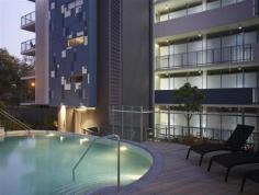 21010/72 Victoria Park Road, Kelvin Grove QLD Fraser Evans of Deborah Evans Properties proudly presents an executive residence with spectacular panoramic city views all within the heart of an urban community on the Brisbane City doorstep.  This exclusive three  bedroom apartment  will appeal to the discerning buyer, investors and those attracted to  architectural design  and inner-city convenience.  Features include:  - Sensational views of the city, Story Bridge, Gateway Bridge and Victoria  Park Golf Course from the sizable alfresco terrace  - Spacious  master bedroom  with built-in wardrobe, a his and her ensuite with extraordinary city views - Generously sized 2nd and 3rd bedrooms with built-in robes -  Modern kitchen  with  stainless steel appliances , gas cooktop and ample cupboard space - The family sized bathroom portrays a level of style and sophistication  - Quality fixtures and fittings throughout - Secluded study nook  - Private laundry room  - Secure parking for two cars with plenty secure visitors parking - Two basement storage cages - Resident on-site  management  and security access The Urban Edge community complex is beautifully designed around lush  tropical gardens and lawns, featuring two impressive pools, an outdoor entertaining area with covered tables and barbecue facilities. A well-equipped theatre room and green space offers endless enjoyment possibilities. Local amenities such as fresh markets, boutique shops, cafes, bars and restaurants are just across the road. Set in the $1 billion dollar Kelvin Grove Urban Village, you'll be perfectly positioned close to QUT, prestigious schools, the Roundhouse Theatre, parklands, walking paths, bikeways, Victoria Park Golf Course and the Royal Brisbane and Childrens Hospitals are all close by.  Well-situated public transport links to the CBD and surrounding districts have been structured for your convenience. Do not miss your chance to own this sensational and rarely available apartment.  Contact Fraser Evans for your next appointment! 