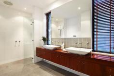 86 Wells Road, Beaumaris VIC Auction 10:30am, Saturday August 9, 2014   $1,295,000 - $1,395,000 3  B  2  b  2  C Watch property video A Statement of Style, Space & Design Get ready to impress with this up to 4 bedroom, 2.5 bathroom spectacular statement of architectural style boasting an exceptional sense of space & an innovative central entertainment zone designed to bring the outdoors in. Superbly positioned only two doors to Illaroo Reserve & pre-school, and a short stroll to the beach, Seaview shops & cafes, schools and the bus.  Beyond a striking copper façade & oversized pivoting door, warm Jarrah & polished concrete floors, expanses of glass & soaring voids define a beautifully balanced layout flooded in northerly light.  Vast living zones are connected to multiple outdoor entertaining areas including a sun drenched central courtyard with glass cafe-style sliders (pizza oven & pond), a private front courtyard with boxed Merbau seating & a shimmering black tiled pool set in rear landscaped gardens. A luxurious Caesarstone & stainless steel appliance kitchen with island bench, butlers' pantry, dual dishwashers & a built in Miele coffee machine is at the heart of inviting family (gas OFP), living & dining areas.  A ground floor study & powder room could double as guest quarters; and complements spacious upstairs bedrooms, 2 with a dual access bathroom & built in robes, and master with his & hers walk in robes and dual vanity, double shower en suite.  Impeccably appointed with all the extras including 3 metre ceilings upstairs & down, extensive storage, ducted heating, evaporative air conditioning, indoor/outdoor surround sound, intercom, security alarm, plantation shutters, Shugg windows, automatic blinds (for void), laundry chute, garden lighting, irrigation, gas pool heating and a direct home access auto double garage. For more information about this statement entertainer please contact Andrew Campbell at Buxton Brighton on 0419 366 545 http://www.86.wellsroadbeaumaris.com/ 