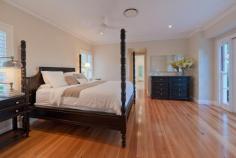 UPPER BROOKFIELD 654 Upper Brookfield Road Bed: 4 | Bath: 3 | Car: 3 | Tennis Court: 1 | Pool: 1 Grand Residence - Private Estate A sanctuary of privacy and nature on a mountain ridge at the southern end of the D’agular range, this magnificent family  home  lays claim to 10 acres of serene bush land in one of Brisbane’s finest boutique  “rural - residential” estates. Incredibly, the home itself is positioned on a flat, landscaped area of over one acre on the top of the mountain, facing North East. This mountain top location affords breathtaking, panoramic views over Brisbane, the  north and south  ranges and beyond to the islands of Moreton Bay. A true sense of arrival is experienced upon approaching the home via automated iron gates and a 250m long driveway, flanked by stonewalls and gardens. A cobblestone circular drive is bordered by manicured gardens and features a beautiful central  lily pond . The home reflects grandeur and elegance inspired by classical European style architecture. It offers absolute privacy, completely uninhibited by neighbours and the hustle and bustle of suburbia. Completed in 2007, the home is constructed of limestone blocks sourced from Mt Gambier, South Australia. Once inside, an impressive entry hall divides spacious his and hers studies. The hall guides guests to the focal point of the home; the “Grand Room”. Open plan in design, the light-filled Grand Room features soaring 14 foot ceilings, oversized windows and French doors and an attractive open  wood burning fireplace . It comprises of the formal lounge, dining and kitchen.  The kitchen is enormous and classical in its design. It features provincial style timber cabinetry, traditional butlers sink and stone bench tops. A striking iron chandelier hangs above the large island bench.  It showcases a comprehensive range of appliances including Ilve oven and gas cook top, integrated coffee machine, 4 dishwasher drawers, microwave and stainless  steel double door  fridge. Adjoining the kitchen is the media room, which includes surround sound and rear projector systems. The grand room opens via  sliding French doors  to an expansive covered entertaining terrace. It enjoys a perfect north east aspect and the most spectacular views of the grounds and beyond. The terrace offers direct access to the sparkling swimming pool. Approximately 16m x 4m, the pool area features Chelmstone paving. The resort style facilities continue with the property also boasting a championship north south tennis court with permaflex synthetic grass and lighting for night games. Ideal for entertaining, a gorgeous gazebo is located adjacent to the court. The main house has four bedrooms; each is generous in size and offers beautiful views of the surrounding bush land. Two of the family bedrooms share a cleverly designed two-way ensuite with separate vanities. The  master bedroom  is located in a private wing and enjoys a north aspect with views to the mountains.  It includes his and her walk in robes and an elegant ensuite with a classic freestanding bath, private shower recess and twin vanities with stone bench tops. A fourth bedroom is reserved as a guest room and is serviced by the family bathroom. There are also two outdoor showers. A laundry and mudroom complete the internal facilities. A large, 80m2 enclosed garage provides housing for 3 vehicles and abundant storage options. One of the most versatile features of the property is the fully self-contained 2 story guest house.  Constructed in 2001, it comprises 2 bedrooms and nursery (or large study) and a bathroom. The ground level offers a kitchen and a spacious open plan living and dining area which is currently used as a home gym and recreation room. There is also a large laundry/craft room and large workshop and storage area at the rear and covered parking for 2 more vehicles. The property is part of a gated rural residential estate, which offers a range of unique and exclusive facilities. These include common parklands with dam and two standard size golf greens. There is also a shared 40-acre equestrian reserve with a fully funded equestrian development plan for stables, arena and paddocks. In addition to the hiking and riding opportunities within the estate, the property backs on to thousands of acres of hiking and riding trails through the D’agular Range, Lake Manchester, Mt. Crosby and Mt. Glorious. Seldom does a unique and stunning residence claiming such significant land size, spectacular views and exclusive facilities become available in a private bush land setting this close to the CBD. This is a rare opportunity to secure a property of distinction, unparalleled privacy and an exclusive lifestyle. Features 4 Hectares (10 Acres) 1 Acre of Level, Landscaped Residential Area Elevated, North-East Aspect Panoramic Views over Brisbane, North & South Ranges & Moreton Bay Pool (approx. 16m x 4m) Championship, Floodlit North-South Tennis Court Gazebo Automatic Security Entry Gates Cobblestone Circular Drive 200,000L Drinking Water Tank (automatic pressure pump) 25,000L Irrigation Water Tank Automatic Irrigation System Established Herb & Veggie Gardens Orchard Area (currently unplanted) Chicken Coop Area 