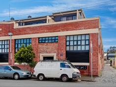 13/18 Ireland Street West Melbourne VIC 3003 Behind the red brick walls of this converted warehouse is a stylish, larger than usual 2 level apartment. Perfectly positioned moments from the heart of North Melbourne providing a vibrant alfresco lifestyle with the Queen Victoria Market and Errol Street at your doorstep. The functional and light filled apartment provides larger than normal bedroom, with access to a north facing courtyard, downstairs open plan living/dining area, beaming with natural light making it perfect for indoor/outdoor entertaining. The contemporary fit-out and well appointed kitchen will make cooking easy. Additional appointments include bright modern bathroom, concealed Euro laundry, polished concrete floors, split-system heating/ cooling, secure intercom entry and secure basement garaging via remote control. You will be delighted with this fabulous home or investment with low outgoings. Inner city living doesn’t get much easier with all modes of transport at your doorstep including the North Melbourne train station plus universities and hospitals moments away.
