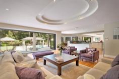 2 The Greenway Duffys Forest NSW 2084 Grand resort-style family residence For a comprehensive eBrochure email darren@kenjacobs.com.au • 2,029sqm, luxurious architect designed home surrounded by manicured gardens • Part of the exclusive Greenway community adjoining the Terrey Hills Golf and Country Club • Sleek European appointed granite kitchen, complete with walk in pantry • Expansive living space features an entertainer’s wet bar and incorporate an elegant formal dining room • A clever layout incorporates French doors to a living room on one side and a cutting-edge home theatre on the other • The upper level features five large bedrooms, all with built-in robes and two with an ensuite and balcony • The lower level also hosts a separate home office, and an additional bedroom suite ideal for guests • Glorious gardens designed by award-winning landscape designer Joanne Green embrace the home • A sparkling glass-framed pool provides the perfect centerpiece complete with a deluxe cabana • Features include ducted reverse cycle air, video intercom, alarm security and internal access to two double lock-up garages. •
 Live in country tranquility with world-class surf beaches and famed 
Northern Beaches & Pittwater attractions just 10 minutes away and 
just 30 minutes to the CBD Inspection: Saturday 12:00pm - 12:45pm by appointment For sale via Expressions of Interest Co - Agent: Shayne Hutton 0400 420 000 