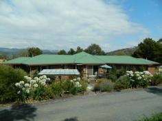  139 Saddle Road, Magra, TAS 7140 You must see this gorgeous home. It is situated on a completely private, internal, 1.38 hectare block, only five minutes from New Norfolk.  The living area of the home comprising a sunroom entrance, wonderful kitchen, dining area, sunken lounge and rumpus room, is in the centre of the house. A veranda folds around the entire front of the home. The left wing has two big bedrooms with robes, a family bathroom, plenty of storage and a laundry. The parents’ wing, at the opposite end, also has two bedrooms and a lovely en-suite off the master bedroom.  The home has quality fittings and is tastefully decorated throughout.  Established gardens, barbecue area, a big garage, workshop and paddocks suitable for a pony contribute to making this a wonderful family residence.  Call for a private inspection. 