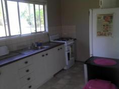  6 Milton Alpha Qld 4724 3 bedrooms one with A/C, large central lounge, functional kitchen and eatery, front and rear porches, separate toilet, seperate shower/bathroom. Its a spacious 130m2 under roof. High ceiling, fibro internal walls, tidy carpets and lino in high traffic areas. The kitchen has lino on the floor, a modern gas stove and oven, its approximately 25m2 in area which includes an eatery area. - See more at: http://belyando.com.au/listings/residential-55668-house#sthash.FzA6bglb.dpuf 