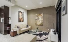  5/918 Hay St Perth WA 6000 One
 word. Perfect. This chic and sophisticated inner-city apartment ticks 
all the boxes where style, design and lifestyle are concerned. Located 
in the “Paris end of town” – the West End, this apartment will not only 
impress, but is guaranteed to provide you with endless enjoyment for 
years to come. The perfect space for entertaining, the perfect 
space for quiet nights in with a glass of red; Apartment Five 
complements whichever mood or mode you may be in. With its 3 metre high 
ceilings, polished concrete Terrazzo floors and thoughtful design, this 
apartment exudes that idyllic urban look and feel and is the perfect 
accompaniment to your cosmopolitan inner city life. For the savvy
 investors out there, this property is currently tenanted at an 
astounding rent of $850 per week. The tenant absolutely loves the 
apartment and recently re-newed the lease until December 31st 2014. Boasting
 a generous 83 sqm of internal living space and a large functional 13 
sqm balcony, you’ll have plenty of room to spread your wings and indulge
 with friends – whether it’s catered cocktail parties or intimate 
gatherings, this apartment delivers. Adding to the overall feeling of 
spaciousness, the open plan living area is lined with floor-to-ceilings 
windows, maximising the high ceilings and making each sunset and 
absolute show stopper. The spacious Master Bedroom includes 
built-in full height robes with plenty of storage space and en-suite 
access to the luxurious bathroom with spa bath. The second bedroom 
provides ample space for multiple uses – a second bedroom, a home office
 or guest bedroom for friends and family. Quality appointments 
are featured throughout the apartment – they just don’t make them like 
this any more. In the kitchen you’ll find gas cooking, stainless steel 
bench tops, a large 6-burner Smeg cooktop (ideal for any eager chef) and
 a Smeg dishwasher. Attention to detail has even been given to the 
lighting, with a combination of contemporary Kreon fittings and an 
abundance of quality down lights. The bathroom features a Kohler vanity,
 Grohe fittings and a soft-close Caroma toilet. Further 
improvements have been made to the property, including an updated ducted
 reverse-cycle Fujitsu air-conditioner, stunning designer dual 
roller-blinds to the living area, a sun-blind to the balcony increasing 
the functionality of the outdoor space and updated shower fittings and 
toilet, all adding further life to the property. Apartment Five 
is one of only 30 apartments at the iconic Box Building – known for its 
architectural intelligence, awards and boutique quality. Ahead of its 
time when it was built, and it remains a standout inner city building to
 this day. Step outside and you’ll be within walking distance to the 
finest Perth has to offer – stroll along King Street and shop at Louis 
Vuitton, Chanel, Gucci and soon to be, Miu Miu. Then toast the night 
away at the likes of Print Hall, Bar Lafayette, Wolf Lane or the small 
luxury hotel, the Terrace Hotel. To inspect this stunning inner-city apartment, please contact Danielle Geagea to arrange your private inspection. 
