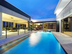 2 Kensington Mews Sovereign Islands Qld 4216 Breathtaking design and construction unite - Stunning
 * Double allotment, 3-4.5 ceilings throughout, timber and stone
 * 5 Grand bedrooms, guest suite, children's wing
 * Concealed home cinema - first class entertainment
 * Marble and Stainless steel details to gourmet kitchen
 * Butlers pantry/scullery - an entertainers delight
 * Built in BBQ Lanai, seamless indoor & outdoor flow with bi-folds
 * Courtyard swimming pool offers superior privacy
 * Travertine, Chandeliers, 4 plus car garage, room for a caravan 