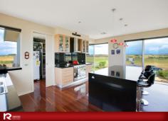 22 Ruthledge lane Port Fairy VIC 3284 Positioned on 18 Acres, this magnificent home of grand proportions, offers the ultimate experience in spacious luxury living, whilst providing the utmost in privacy and creating the perfect environment for harmonious modern living. Designed to take full advantage of the surrounding landscape, the expansive use of glass provides fantastic views that are captured at every turn blending the indoors seamlessly with the outdoors. Thoughtful planning has resulted in a floor plan that provides multiple living zones to cater for everyones needs. The ground floor is a wonderful haven for children and guests offering 3 bedrooms, large sumptuous bathroom, guest powder room and a separate living room which flows out to a sheltered courtyard. The upper level is even more accommodating offering an indulgent master suite including ensuite and walk in robe with another guest powder room just down the hall. The second living room features large windows framing views of the nearby dunes and a gas log fire brings warmth in winter. The impressive dining/kitchen area is of open plan with the main attraction being a striking, streamline fully equipped kitchen using the highest quality cabinetry, granite bench tops and stainless steele appliances, which is sure to impress the most seasoned entertainer. There is also a large walk in pantry and a discreet home office tucked away in the corner. Another outdoor courtyard is conveniently located close to the kitchen and a crowâ€™s nest adds an element of difference allowing views of the Ocean. Outside the garden has been been fully landscaped for easy care and there are a few paddocks suitable for horses or livestock. A huge 4 bay shed has a workshop with 3 phase power and a double garage provides parking for two vehicles. Located close to Killarney within a short drive to Port Fairy this wonderful home is immaculately presented both inside and out with simply not a thing to be done except to move in and enjoy its stunning surrounds.