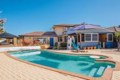  20 Clifton Gardens, KALLAROO 6025, WA **GRAND OPENING THIS SUNDAY 17th Aug 12.30 – 1.15pm**.. ……** FOR SALE
 XPRESS: All offers presented Tues 26th August at 7pm**……..Set on an 
expansive 1,012sqm block in a quiet cul-de-sac, this 5 bedroom, 2 
bathroom plus study immaculately refurbished family home boasts 
captivating Indian ocean views from the upstairs balcony. 
Step inside to gorgeous marri floors via the double door entrance, 
leading through to the generously sized home office that could be used 
as a sixth bedroom. The expansive master suite is fit for a king and 
queen and comes complete with WIR and stunning new bathroom complete 
with stone bench tops and double basins, double shower with gorgeous 
glass splashback and overhead rain shower. 
Make your way through to the hub of the house with open plan 
kitchen/dining/living overlooking the outside alfresco area. The gourmet
 kitchen is sure to impress any budding master chef and features stone 
bench tops, glass splashback, soft closing drawers with oodles of 
cupboard space, top of the range appliances including a Miele dishwasher
 and Technika stainless appliances including an in-built coffee maker. 
Meander outside to the timber lined alfresco, massive pool with plenty 
of space for the kids to play and gazebo area with barbecue. The kid’s 
wing features 3 double bedrooms that are all bigger than many master 
suites. All come complete with fitted out BIR with a second renovated 
bathroom, again with stone bench tops, shower and bath with a unique 
glass splashback featuring Where’s Wally and Nemo. 
Upstairs you will fall in love with the theatre/games room with 
fantastic bar/second kitchenette area with a gorgeous solid jarrah top, 4
 integrated temperature controlled bar fridges, sink with hot and cold 
water, built in shelves, glass splashback and theatre projector screen! 
Featuring a guest bedroom upstairs with stunning views you simply can’t 
go wrong! Ideally located in walking distance to St Marks Anglican 
School, Whitfords shopping centre, Whitfords beach, the local Montague 
Park with play equipment, Hillarys boat harbour and Mullaloo beach a 5 
min drive and easy access to the Mitchell freeway you won’t be 
disappointed. 
Other features include 
-	Ducted reverse cycle air conditioning 
-	Neutral carpets and colours throughout 
-	Formal lounge and dining area 
-	Monitored Alarm system 
-	Huge double remote control garage with room for 2 cars and a jetski 
-	Reticulation throughout 
-	Room for parking boat/caravan 
-	Gas hot water system 
-	4 bedrooms located downstairs with guest room upstairs 
-	Extra storage in roof 
- 
Automatic roller shutters to front of house and en suite