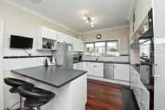  180 Odin Road, Innaloo WA 6018 Warmth, cosiness and convenience awaits you within this character-filled 3 bedroom 1 bathroom residence on a generous 462sqm corner block in very close proximity to public transport, the freeway, parks, shopping, schools, cinemas, restaurants, medical facilities and so much more. The potential is evident! Features include, but are not limited to: • 	 High ceilings and solid Jarrah timber flooring throughout • 	 Stunning outdoor entertaining deck with a wood fire pizza oven and a built-in six-burner gas barbecue • 	 Spacious front lounge room with carpet and split-system air-conditioning • 	 Renovated kitchen and dining area with a ceiling fan and a breakfast bar for meals • 	 Quality Bosch appliances (gas cook top, dishwasher and separate oven) in kitchen • 	 Blanco range hood and sleek white cabinetry • 	 Large main bedroom with a ceiling fan • 	 2nd bedroom has a built-in wardrobe • 	 3rd bedroom has a robe recess and a fan • 	 Revamped modern bathroom with a separate bath tub and shower • 	 Rear sunroom with access outdoors and to the laundry with a toilet • 	 Side patio for further outdoor entertaining • 	 Lock-up outdoor storeroom • 	 Single lock-up carport • 	 Plenty of driveway parking • 	 Double linen/storage cupboard • 	 Gas hot water system • 	 Scope to add your own personal touches throughout 