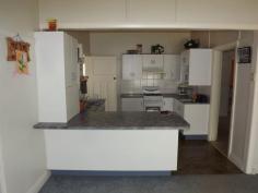  101 Church Street Glen Innes NSW 2370 For the medium price home buyer or investor - consisting of 3 bedrooms all with built ins, 2 bathrooms with toilets, front patio, spacious open plan kitchen/dining, separate living/lounge area with wood heating, gas kitchen and h/w system, laundry, plenty of linen storage cupboards, enclosed rear grassed in patio/morning breakfast, garden, concrete driveway to lock up garage, workshop, childrens play station with rear yard that is completely child & pet friendly. 