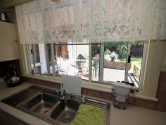  12 Haven St South Grafton NSW 2460 An air conditioned formal lounge opens onto an east facing front verandah with expansive views. There is a formal dining area, however, a breakfast area has been incorporated into the modern laminated kitchen that boasts large pantry space and new electric range. The bathroom features both shower and tub with toilet located separately. An extra large main bedroom includes wardrobe and an air conditioner. A shade sail protects the rear timber deck during summer months and can be taken down to allow in more sunshine over winter. That makes it perfect for bbq's. The shady yard is quite private and only takes a few minutes to mow. An extra large single garage provides storage and workshop space, plus, there is a carport to keep a 2nd vehicle or maybe a boat out of the weather. A really beaut little street with little traffic and great neighbours. Definitely must be inspected so put it on your list. 