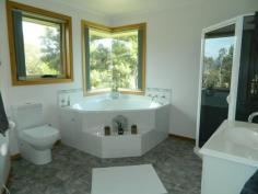  139 Saddle Road, Magra, TAS 7140 You must see this gorgeous home. It is situated on a completely private, internal, 1.38 hectare block, only five minutes from New Norfolk.  The living area of the home comprising a sunroom entrance, wonderful kitchen, dining area, sunken lounge and rumpus room, is in the centre of the house. A veranda folds around the entire front of the home. The left wing has two big bedrooms with robes, a family bathroom, plenty of storage and a laundry. The parents’ wing, at the opposite end, also has two bedrooms and a lovely en-suite off the master bedroom.  The home has quality fittings and is tastefully decorated throughout.  Established gardens, barbecue area, a big garage, workshop and paddocks suitable for a pony contribute to making this a wonderful family residence.  Call for a private inspection. 