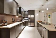 207 Gaebler Road,	
	AUBIN GROVE WA 6164 Closing date Sale 11 August 2014 by 5 pm. The Sellers reserve the right
 to sell prior. They have bought elsewhere and need to move this 
magnificent home HAS IT ALL where family living and fabulous 
entertainment zones blend seamlessly together. Ideal also for extra 
parking a boat or caravan with enclosed side access plus large lockup 
garage and roller door to the backyard, Contemporary design and 
ultimate entertainer full of extras and additions to maximise every 
aspect. Ideally situated a short stroll to the local shops, Aubin Grove
 primary school, nearby parklands, and transport at Lyon Road. Boasting
 a corner garage this connects to a masterfully built outdoor kitchen 
(man cave) with built in oven, barbecue, high spec sink, tap ware and 
built in cupboards. The indoor kitchen provides banks of cupboards,
 central island bench, twin draw dishwasher, under bench oven and range 
hood, the master chef tap ware will impress. High ceilings in the open 
plan living area is a WOW factor. Separate Theatre room, . Step out to 
the Dome Patio to a fabulous backyard were the children and pets have 
room to play, or space for a pool. Extensive exposed aggregate pathways
 and paving. King side Master suite, his/ her robes, ensuite with twin vanity and bath. Spacious minor bedrooms with built in robes and a study. The laundry has plenty of built in cabinetry, storage and the bathroom is conveniently located. 4 Split system reverse cycle air conditioners. Gas Point Twin draw dishwasher Gas hot plates and hot water system Solar Panels Porcelain tiled floors to living areas and carpet to bedrooms. Quality window treatments, drapes, fixtures and abundance of down lights and feature lighting. Security flyscreen front door and sliding doors to patio.   
			 