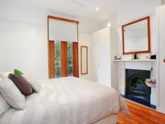  119 Curtis Road,Balmain NSW 2041 An abundance of great design ideas are presented in this light filled three level chic Balmain terrace conveniently located in the heart of Balmain. Fully renovated with great taste and style  with impeccable presentation, the home offers 3 bedrooms,  separate lounge and dining rooms ,luxury spa bathroom, integrated kitchen with stainless steel European appliances (gas cooking) and plenty of cupboard and work place. Filled with the warmth of natural timber and lots of light the living area opens to entertainer’s deck and  paved, leafy courtyard with water feature.  Genuine period features include fireplaces, iron-laced balcony, high ceilings beautiful polished floor boards. Convenience features are  plenty of storage, reverse cycle air-conditioning, gas heating connection, stylish glass balustrade, garden sprinkler system. Harbour Bridge and City Skylight views are enjoyed from the loft bedroom. Balmain village with restaurants, cafes, shops, ferry service and buses is only a short stroll away. 