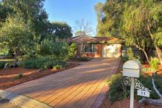 11 Waratah Court, WEST BUSSELTON WA 6280 Located in the exclusive Kalgaritch Estate, close to schools, Leisure Centre, and a short drive to the pristine waters of Geographe Bay and downtown Busselton. This country style home sits on a whopping 2,988 m2 block at the end of a cul-de-sac and would be an ideal home for any family. The property consists of two brick and tile buildings, an 8x8 shed with an annex ideal for a caravan or boat and an underground swimming pool. Outdoor living at its most enjoyable!  The main house boasts open plan living with a wood burning fireplace, reverse cycle air conditioning and vaulted ceilings in the kitchen, dining and family room all overlooking the expansive gardens. The master bedroom with en suite and walk in robe, accompanies two minor bedrooms with built in robes and a main bathroom and WC. A separate theatre room and study complete the picture. Step across a covered walkway from the main house to the second building overlooking the swimming pool which is perfect for entertaining or could be a 4th bedroom, kids retreat, artist's studio or home office...the possibilities are endless. There is also a second WC and laundry utility room. Enjoy the warmer weather relaxing under the north facing gabled patio, overlooking the expansive gardens, which are a horticulturist's haven showcasing native bush land, room for a great vegie patch, citrus grove, or stone fruit orchard and open space all enticing the kids to adventure. Don't wait - this one is a gem and won't last long! 