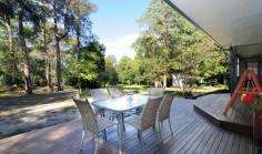  80 The Wool Road Basin View NSW 2540 Live the relaxed lifestyle on this low maintenance easycare acreage. Situated within walking distance of the local school, shops, medical centre, parks and access to the inviting waterway "St Georges Basin". Modern four bedroom family home with study/office. Mostly renovated with stunning polished timber floors. Enormous combustion fireplace warms the entire house. High ceilings in lounge/dining create a sense of space. Double slider opens onto east facing entertaining deck. Huge double garage with ample workshop space at the rear. 2.5 acre parcel with room to expand or add more garages. Freestanding outhouse, used as a gym/teenage retreat. Large grassed area for the kids or animals to run around. Quality bird aviary could be converted into a chook pen. This property really is a quality small acreage that has endless potential and is now priced sell! 