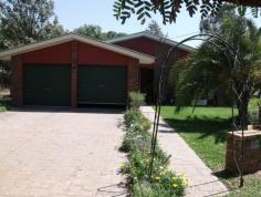  88 Northern Road  Roma Qld 4455 This beautifully presented lowset brick home boasts 4 built-in bedrooms, master with walk in robes and ensuite. Modern kitchen with dishwasher and pantry, separate dining and separate living areas, wood heater, ducted air conditioning plus reverse cycle in main. Large tiled bathroom with separate shower and bath. Fully screened with security doors, new floor coverings, new paint work inside, 2 bay lockup garage, paved and covered outdoor entertainment area leading off into the established lawns and gardens. Two rainwater tanks, separate 3m x 3m garden shed and rear yard fully fenced, all this in a flood free area. 