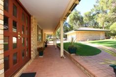 205 patrick pl mundaring WA 6073. If
 location is important look no further than this beautifully presented 
quality 5 bedroom 2 bathroom b+t solar efficient family home in 
Mundaring. Lovely, bright, modern and welcoming internal accommodation 
with high ceilings, superb kitchen and quality finish. Set on a 1 acre 
block at the end of a peaceful cul-de-sac, all the work is done, just 
move in and enjoy. • Walk to school, shops and public transport  • Main bedroom en-suite and walk in wardrobe. • 4 further good sized bedrooms all with built in wardrobes. • Large family bathroom, spa bath and shower enclosure. • 3 living areas, family, games and parents retreat/study • Large oak kitchen with integrated larder unit, Belling Sterling chefs stove. • Blackbutt flooring to main living areas. • Fully fitted laundry room. • Huge 10.5m x 6.5m outdoor entertaining area (with café blinds). • Below ground salt water pool with solar pool heating. • Evaporative ducted Air-con. • Remote split system to main living area. • Edwards solar hot water with electric time clock boost. • Slow combustion wood stove with domestic hot water heating. • Solar electric panels . • Detached powered b+t double lock up garage/workshop, plus parking space for 6 cars. • Landscaped lawns with fully automatic retic. • Fully insulated roof void (fibreglass)   • Established fruit trees and prolific passion fruit vine. Nearest Schools: 
 Mundaring Primary School, Mundaring Christian College, Mt Helena 
Primary School, Eastern Hills Senior High School, Sacred Heart Primary 
School, Parkerville Primary School, Helena College Senior School. 