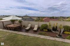  22 Catspaw Ave Beeliar WA 6164 COME FEEL RIGHT AT HOME HERE!! As you walk in the large double door entrance you immediately get that feeling of quality and that you truly are at home. This stunning 4 x 2 family home is situated in the much loved Meve Estate, positioned on the street to capture stunning views of the city and surrounding area.  *Large king size master Bedroom with his and her walkin robe, which leads to a great size ensuite. The ensuite is tiled from ceiling to floor and includes large corner spa bath, vanity, shower, IXL light/heat lamps and separate toilet.   *Remaining bedrooms are all queen sized with carpet, bedrooms 3 and 4 have stunning views and complete with walk in robes. *Outside entrance features cedar lined ceiling with downlights. *Sunken lounge room with beautiful lighting and carpet. *Separate formal dinning area. *Stunning kitchen with large bench top giving plenty of room for a breakfast bench, lots of cupboards including overhead cupboards, stainless steel appliances including electric oven, gas hot top with range hood, dishwasher, double sinks and large pantry. The shoppers entrance allows for easy access. *Kitchen is part of open planned area, over looking another dining area and 2nd lounge which leads to alfresco area.   *Large reverse cycle ducted air conditioner. *Gas bayonet for extra heating is located in the open planned area. *Large linen, big laundry with separate toilet. *Black Butt flooring throughout. *Feature lighting throughout home as well as outside just show the class of this home. *Large paved outdoor entertaining area has cedar lined ceiling with down lights, caf blinds to fully enclose the area and spectacular views.   *There is a great patch of grass but the feature of the backyard is the lower decking area and water feature, fantastic for entertaining and finished with a no fuss garden with automatic reticulation. There is also a rear gate for access from the front. *Large double garage with automatic door with extra room for storage. Located near local shops, primary schools, easy public transport and just minutes to both Cockburn Gateways Shopping and Coogee beach this home is a must see.   