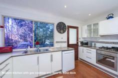 First Choice Property Centre - TAMBORINE MOUNTAIN 12 Jura Court Just you and the birds are here to enjoy this wonderful oasis of peace 
and tranquility, backing onto a nature reserve it will never be built 
out. You will never want to leave, which is a great possibility as 
there is a great space downstairs to work from home. Guest will love 
the downstairs fully self-contained area but be careful because grown up
 children may never want to leave home!! ~ Split level mountain style home ~ Fabulously high cathedral ceilings in the lounge ~ Glass sliding doors to a large covered rear deck ~ Light flooded living with big windows all round ~ Modern kitchen with plenty of bench space & storage ~ Three bedrooms on the upper level with built in robes ~ Freshly modernised bathroom with separate toilet ~ Down to another spacious lounge room with kitchenette ~ Fourth bedroom with window overlooking garden ~ Shower room downstairs ~ Great additional room with an external door to the driveway ~ Sliding glass doors to a lovely covered patio ~ Easy care gardens leading down to a babbling brook ~ Double carport with space to put in a garage if wanted ~ Fully renovated there really is nothing to do here 