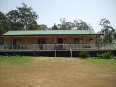  49 Gehrke Rd Glenore Grove QLD 4342 Here is a great opportunity for you to own your own piece of country seclusion on 7 acres and only a short drive to Plainlands shopping centre and 35 minutes away from Ipswich CBD. A lovely country style home with full length front verandah is situated in a high position on a gentle slope and overlooking the dam. Your privacy here is assured as there are no close-by neighbours. The home features a solid timber kitchen of New Guinea Rosewood with Spotted Gum bench tops – the envy of every cook. The spacious open plan living rooms have cathedral ceilings and french doors opening to the verandah as well as polished timber floors (Spotted Gum), air conditioning and a wood heater for the chilly winter months. Extras include Pink Batts in the ceiling, security bars, ceiling fans, whirly bird on the roof and a covered walkway to the 2 bedroom, fully self-contained granny flat – ideal for the relatives, as a teenagers retreat or as a large rumpus/entertainment room. There is also a double carport, storage shed and a dog enclosure. This property has so much to offer, close to highway access, but not close enough to hear the noise. Tranquil and peaceful – once you come to inspect, you won’t want to go home. Call Sue today to arrange your country visit. 