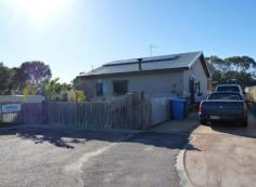  20 Princess Street Pink Lake WA 6450 Tucked away at the end of the cul-de-sac, sits a gardeners oasis. Featuring kitchen/dining with gas cook top, range hood, dishwasher, RC aircon as well as the bonus of cooking a rustic meal upon the wood combustion stove. Timber floors throughout the 3 bedroom fibro residence, just ready to move in and enjoy. Tranquil garden outlook when entertaining within the massive semi enclosed patio. Self-sufficiency is easy with solar panels, well designed veggie patch and chook pen, Jamie Durrie would be proud! 
