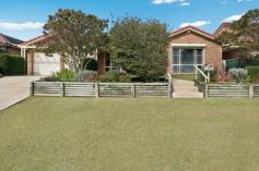  23 Baker Drive Tenambit NSW 2323 Positioned in a quiet cul-de-sac of Tenambit is this proud 3 bedroom home with established manicured gardens with a water system. Elevated to see the view towards the Hunter River and farmlands. Freshly painted with window furnishings throughout, fully air conditioned and clean carpets all ready for you.  Master bedroom has beautiful mirrored built-ins and an ensuite with vanity that has excellent storage and a large shower. 2 other bedrooms include 4 door built-ins with shelving, and ceiling fans. Lounge room that overlooks the view and is off the central part of the home, the combined kitchen/meals area, with double door pantry with pull out shelving, electric oven and a single drawer dishwasher. Main 3 way bathroom with large shower recess, bath and long vanity and separate toilet, plus the laundry with rear access to the yard. Separate double sliding doors lead out onto the undercover paved entertaining area that overlooks the fully fenced beautifully manicured lawns and landscaped gardens where treated timber edging is the feature, and a double lock up garage with drive through access and remote. Tenambit is close to all amenities and nearby historic town Morpeth with its fashion boutiques, cafes and speciality shops. 