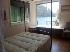  Lot 19 Calabash Bay Berowra Waters NSW 2082 Sunny, North-facing 1 bedroom cottage, on water’s edge Living area opens to good verandah overlooking deep waterfront Basic kitchen, bathroom, laundry, and compost toilet  Two good-size areas on lower level, with potential for workshop, bedroom, studio  New ramp and pontoon  Land adjoins small reserve on one side, and plenty of space behind house for extension  All services available, and only a short boat ride to secure residents’s marina and carpark Fantastic value at this price General Features 