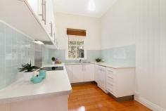  23 Pitt Street, Paddington, QLD, 4064 Just footsteps from Latrobe Terrace and Paddington Village is this gorgeous, light-filled spacious cottage. Nestled in an expensive enclave of properties, this home is an oasis of tranquility amidst the vitality of Paddington. The home features rare Oregon polished floorboards in immaculate condition, and has recently been painted inside and out. Entry to the generous open plan living and dining areas is through a north-east facing sun room with a sweeping vista of Paddington and Red Hill. An extremely spacious master bedroom enjoys views, breezes and morning light. There is a queen sized second bedroom with built-ins and a good sized third bedroom or study. The kitchen has been designed with loads of cupboards and generous bench space with modern dishwasher and appliances. It is a fresh, clean productive space that all cooks will enjoy. There is a private courtyard at the rear of the property sheltered by a terraced bush garden. 