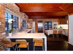  11 Ballidon Crescent Carine WA 6020 Traditionally designed and quality crafted family residence, situated in a tranquil park side location, unrivalled in position by any other in this popular and sought after family suburb. Generous size rooms, high ceilings, bay windows, French doors and a lavish use of natural timber throughout, combine to create a truly unique and inviting atmosphere over two exciting levels. Accommodation comprises of five very large bedrooms, two bathrooms, three separate living areas over both levels plus a large, contemporary style, centrally located kitchen forming the heart of the home. Overlooking a fabulous and private rear garden with a sunny north aspect, the kitchen enjoys a command post view over an expansive “all seasons” outdoor entertaining area, a true swimmers pool and the treetops of ‘Ballidon Park’. Both bathrooms upstairs have been recently refurbished to a high standard and there is a large laundry room with an extra shower and 3rd WC, handy with the pool nearby. There is a lot of storage space built in over both levels. - See more at: http://www.spraggongeorge.com.au/listings/residential_sale-211719-carine#sthash.rcMkcBSz.dpuf 