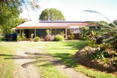  1111 Landsborough-Maleny Rd Maleny QLD 4552 ALL REASONABLE OFFERS WILL BE CONSIDERED. Very neat three bedroom low set brick home on a lovely flat 2187m2 which has a dog fenced back yard, two garden sheds, several bush houses and an orchard. Features include high ceilings, slate tiled floors in the kitchen and dining area. The spacious master is air conditioned and has a big wardrobe, other bedrooms have built-ins. The kitchen adjoins the family/dining area and there is a separate lounge room. A covered entertainment area protected from the weather ideal for BBQs and outdoor relaxing is added bonus. Lots of other extras include ample storage space, wood burning fire, 12 solar panels, security screens, irrigated gardens, auto sprinklers, 27,000 gallon rainwater supply and a remote control lockup garage. There is also a large caravan and boat shed. Only a few minutes drive into town this property represents EXCELLENT VALUE FOR MONEY and should be added to the list of any buyer looking for a nice parcel of land with a comfortable home at an affordable price. Building and pest report available. 