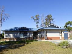 11 King Parrot Parade Gulmarrad NSW 2463 This is a large family home offers room to move and room to grow. A 
quality home with many additional features to make life and living a 
little easier. It is located in the Gulmarrad area which is only 5 
minutes drive from the town of Maclean situated on the banks of the 
Clarence River and 15 minutes to the family beach and picnic areas of 
Brooms Head. 
 The entire property consists of a one acre gently sloping block of 
land which is fully fenced; a substantial, modern brick home; a 
colourbond shed (11m x 6m) with power; a double carport and sealed 
driveways.
 The home features ducted air conditioning, which controls the 
temperature throughout all the living and bedrooms in all seasons. There
 are five very spacious living areas - lounge room, dining area, family 
room, Media room and outdoor area. The sale of the home includes a 
projector and screen in the media room, as well as a built-in stereo and
 flat screen T.V. in the entertaining section. 
 Floor tiles are a main feature throughout and raked ceilings in the 
dining room adds to the depth and appeal of the home. The modern kitchen
 boasts stainless appliances including a new oven and is located in the 
central part of the home. This is the focal point for family activities.
 Sliding doors from here lead out to the wonderful screened outdoor area
 which offers a fantastic extension of living for entertaining.
 The master bedroom features a lovely ensuite with a separate toilet 
and a walk in robe with itemised shelving and hanging space. The other 
three bedrooms are all very generous in size. They include ceiling fans 
and built-in wardrobes. The home also includes a very large study so 
there is certainly plenty of room for everyone.
 Many of the grand features in this fabulous home are white timber 
shutters on all of the windows and sliding doors; ceiling fans, ducted 
air-conditioning and LED lights throughout.
 This is an exceptional home at a realistic price. 